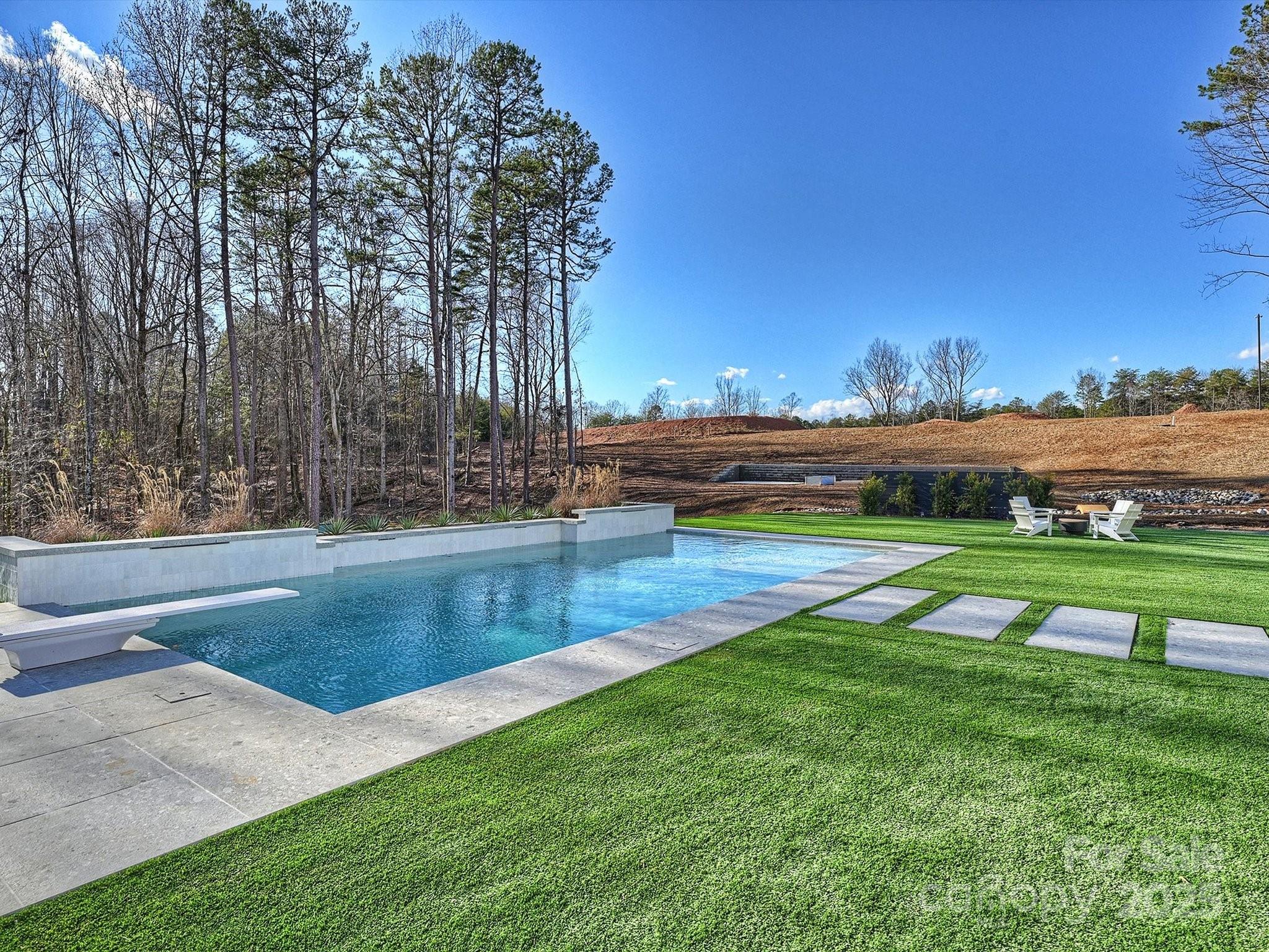 1525 Shinnville Road Cleveland, NC 27013 - Photo 37 of 48 a view of outdoor space with swimming pool and green space