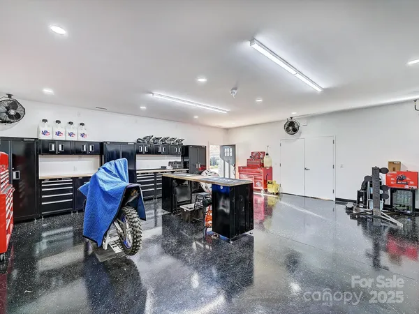 a kitchen with a table and a a refrigerator