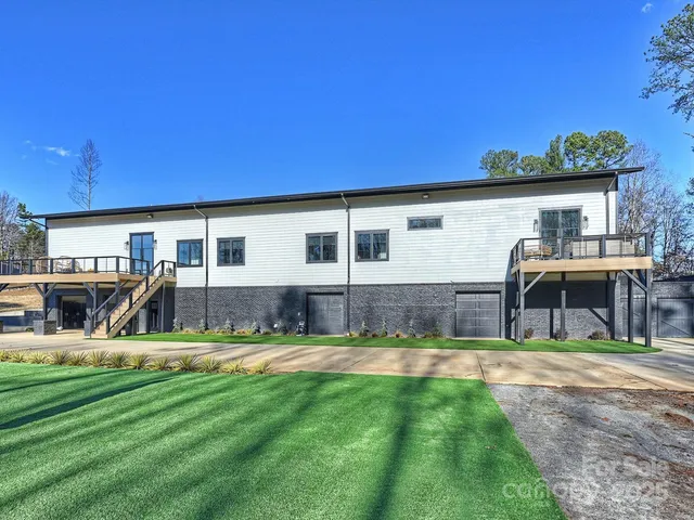 a view of a street with a houses in the background