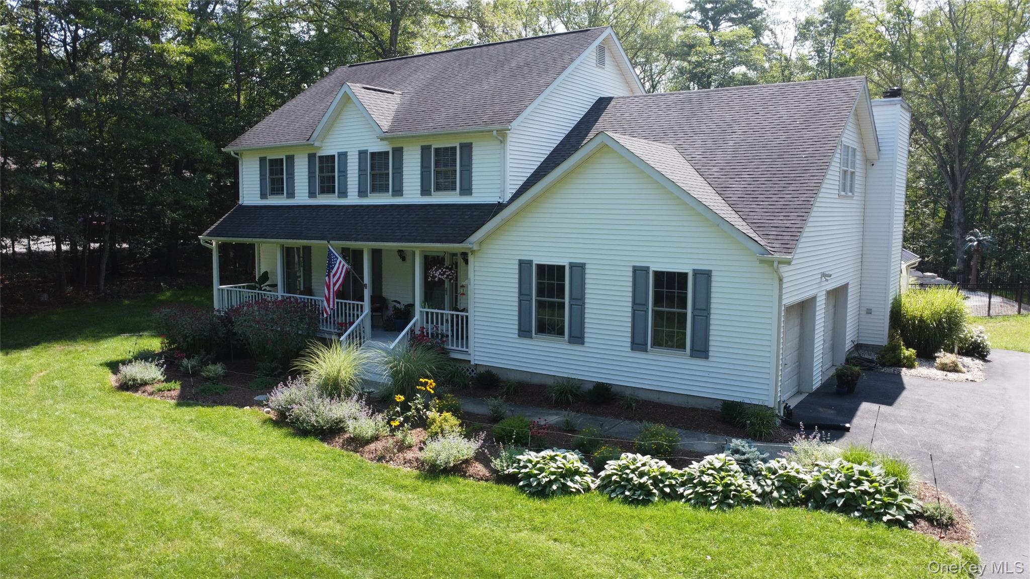 95 Weed Road Pine Bush, NY 12566 - Photo 2 of 31 Two-story home with white siding, a covered front porch, and a two-car garage