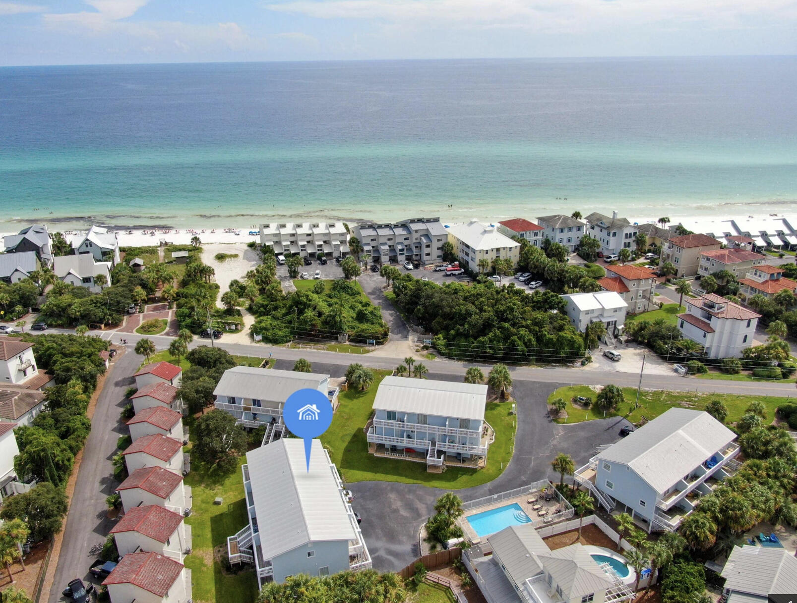 209 Blue Mountain Road, Unit 303 Santa Rosa Beach, FL 32459 - Photo 1 of 1 an aerial view of a house with a garden