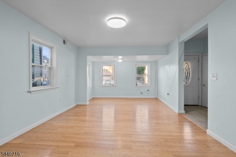 136 Smith Street Elizabeth, NJ 07201 - Photo 14 of 38 an empty room with windows and closet