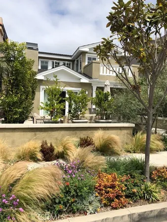 a view of swimming pool with outdoor seating and plants