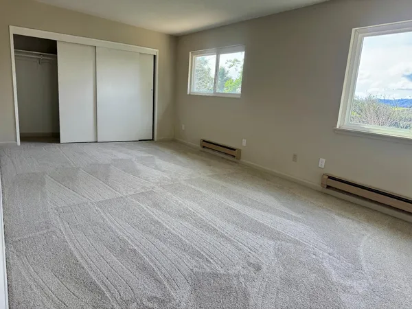 an empty room with windows