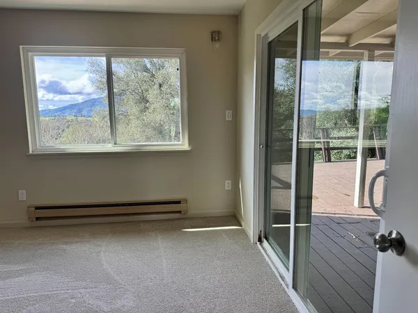 a view of a room with a large window
