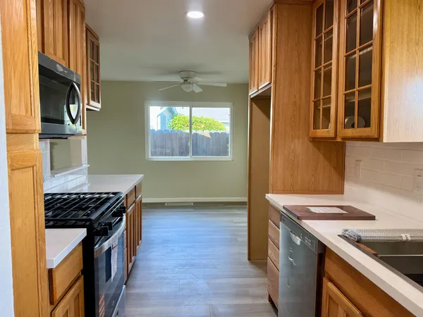 a kitchen that has a sink and a stove