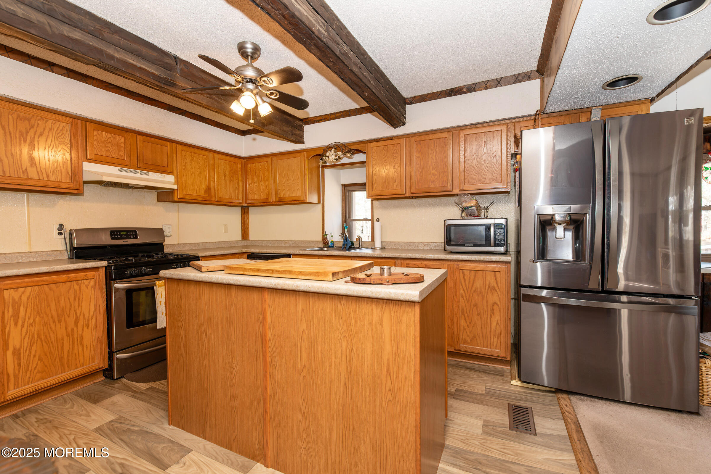 220 Chatsworth Tuckerton Road, Unit A Chatsworth, NJ 08019 - Photo 33 of 59 a kitchen with stainless steel appliances granite countertop a refrigerator a sink and dishwasher
