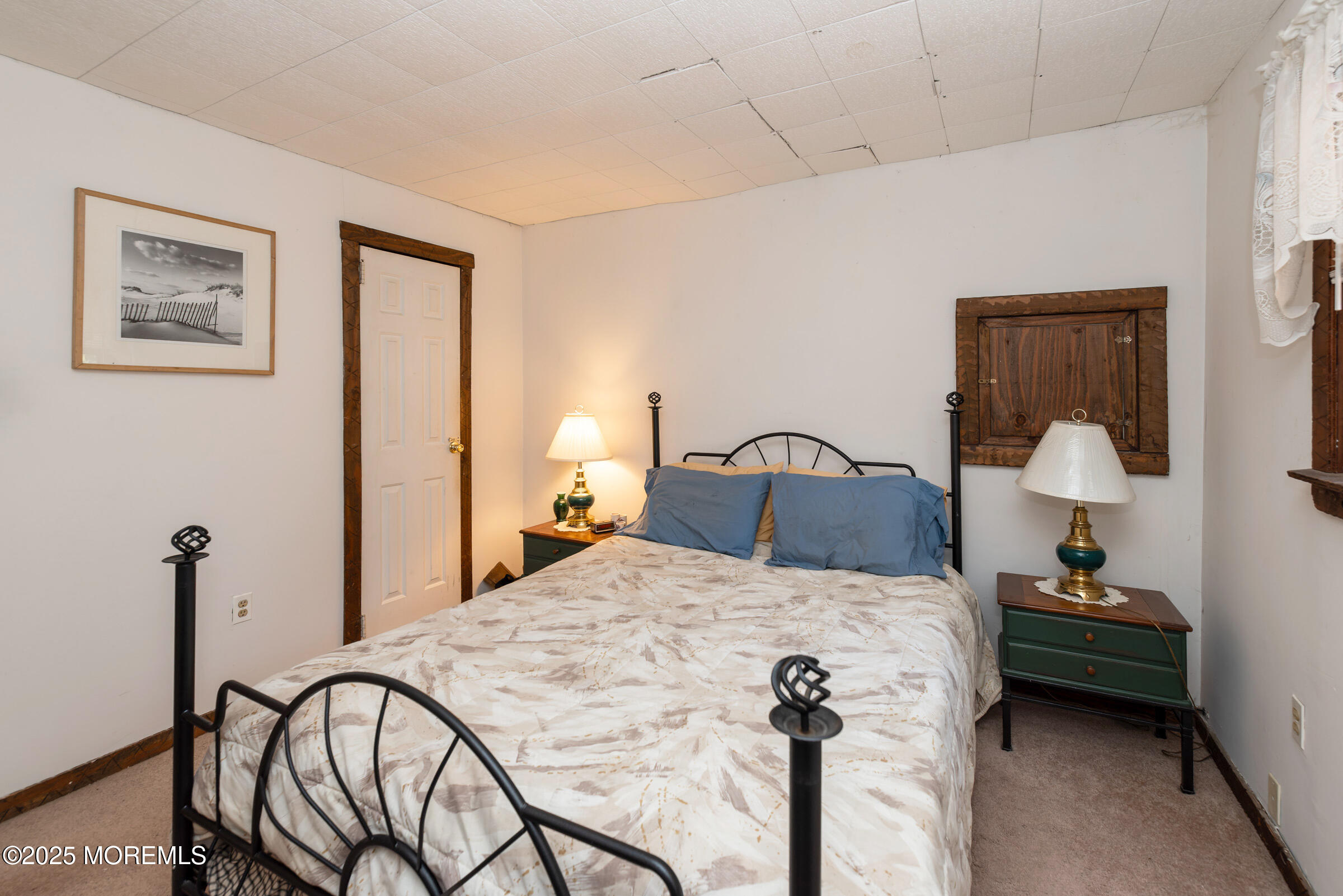 220 Chatsworth Tuckerton Road, Unit A Chatsworth, NJ 08019 - Photo 40 of 59 a bedroom with a bed and a lamp on table