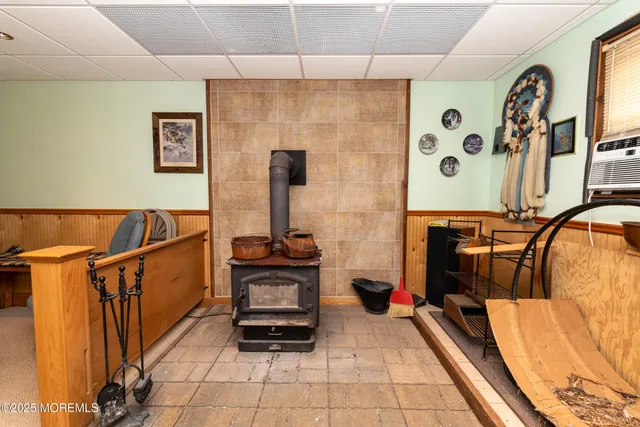 a bedroom with furniture and a flat screen tv