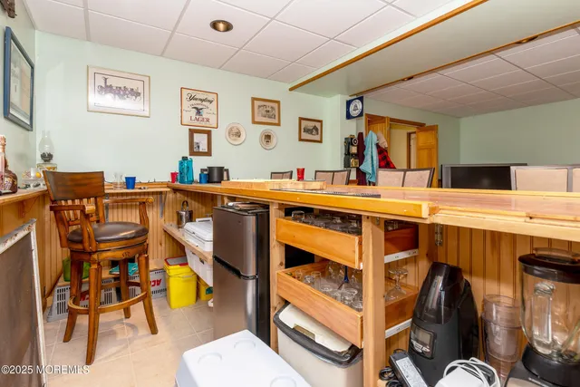 view of living room with granite countertop furniture and fireplace