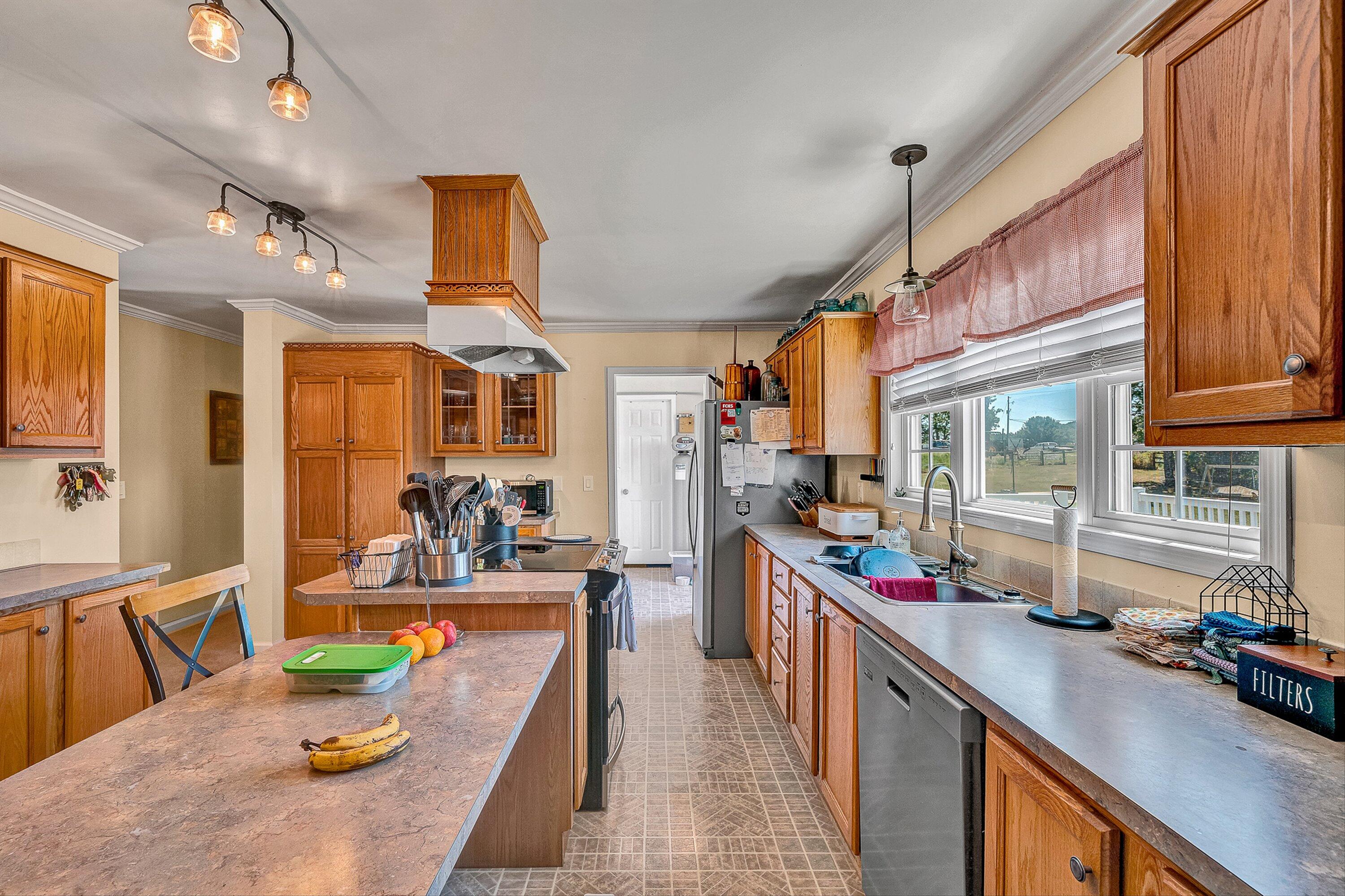 159 Simmons Creek Road Union Hall, VA 24176 - Photo 12 of 55 a kitchen with stainless steel appliances lots of counter top space
