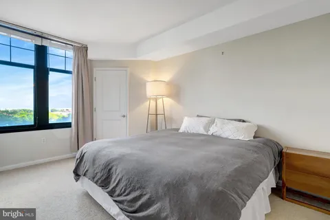 a large white bed in a hotel room
