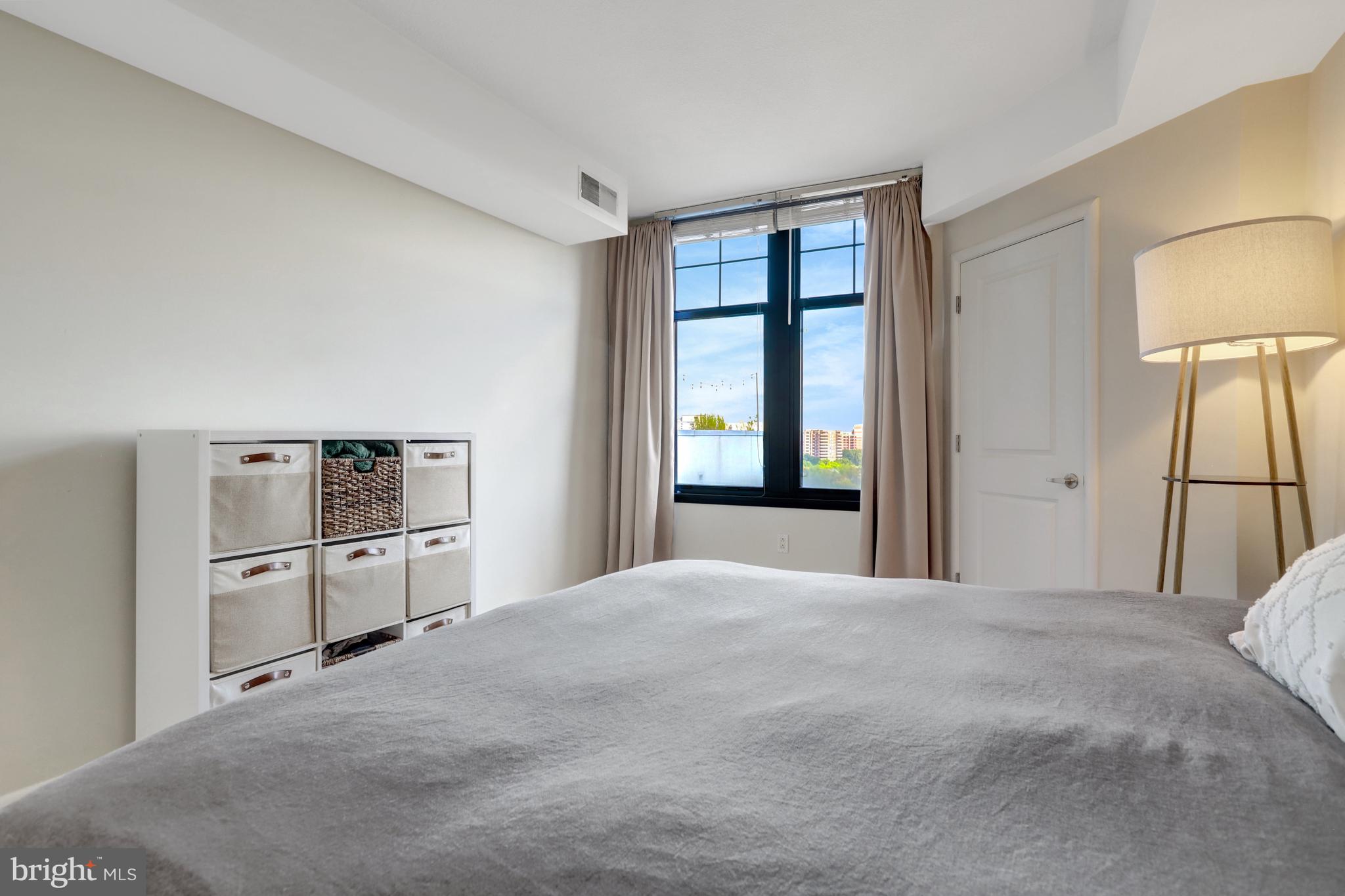 1021 North Garfield Street, Unit 914 Arlington, VA 22201 - Photo 15 of 63 a large white bed in a hotel room