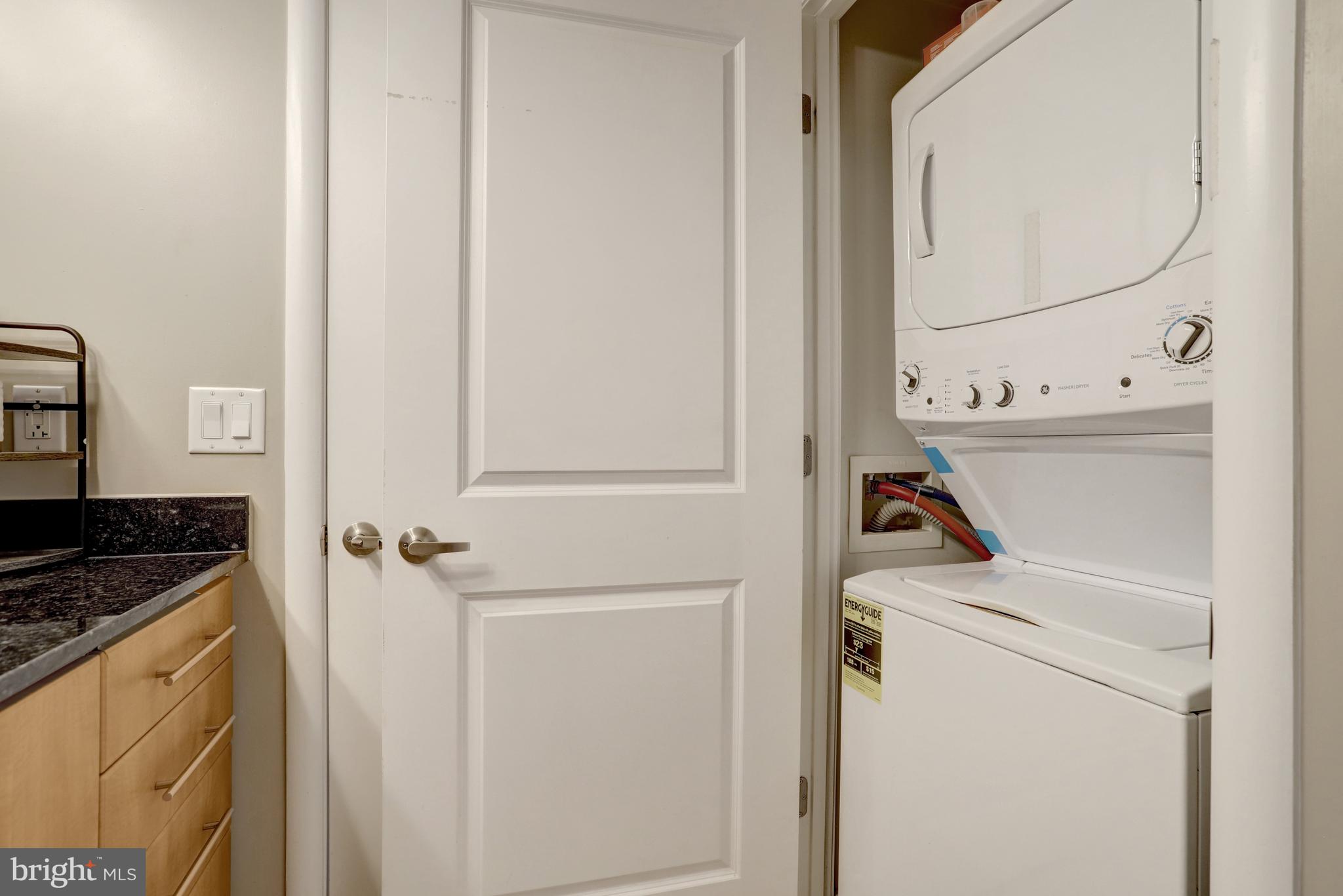 1021 North Garfield Street, Unit 914 Arlington, VA 22201 - Photo 22 of 63 a utility room with dryer and washer