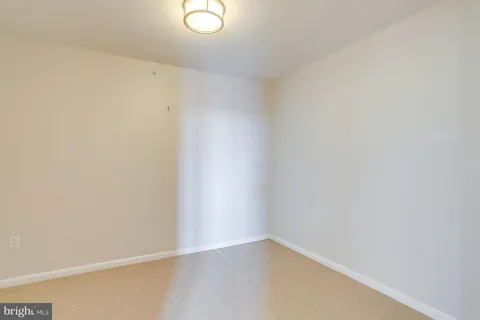 a view of a balcony with wooden floor