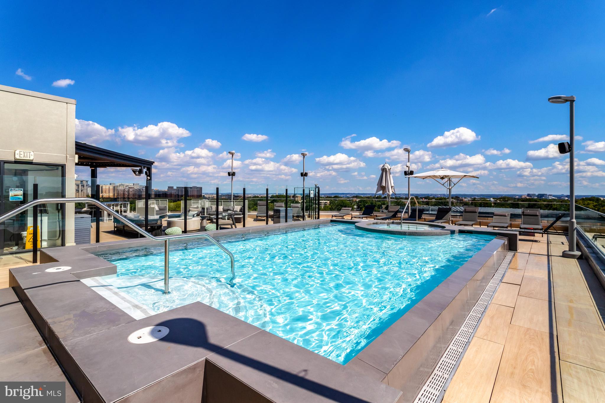 1021 North Garfield Street, Unit 914 Arlington, VA 22201 - Photo 28 of 63 a view of a swimming pool with a patio