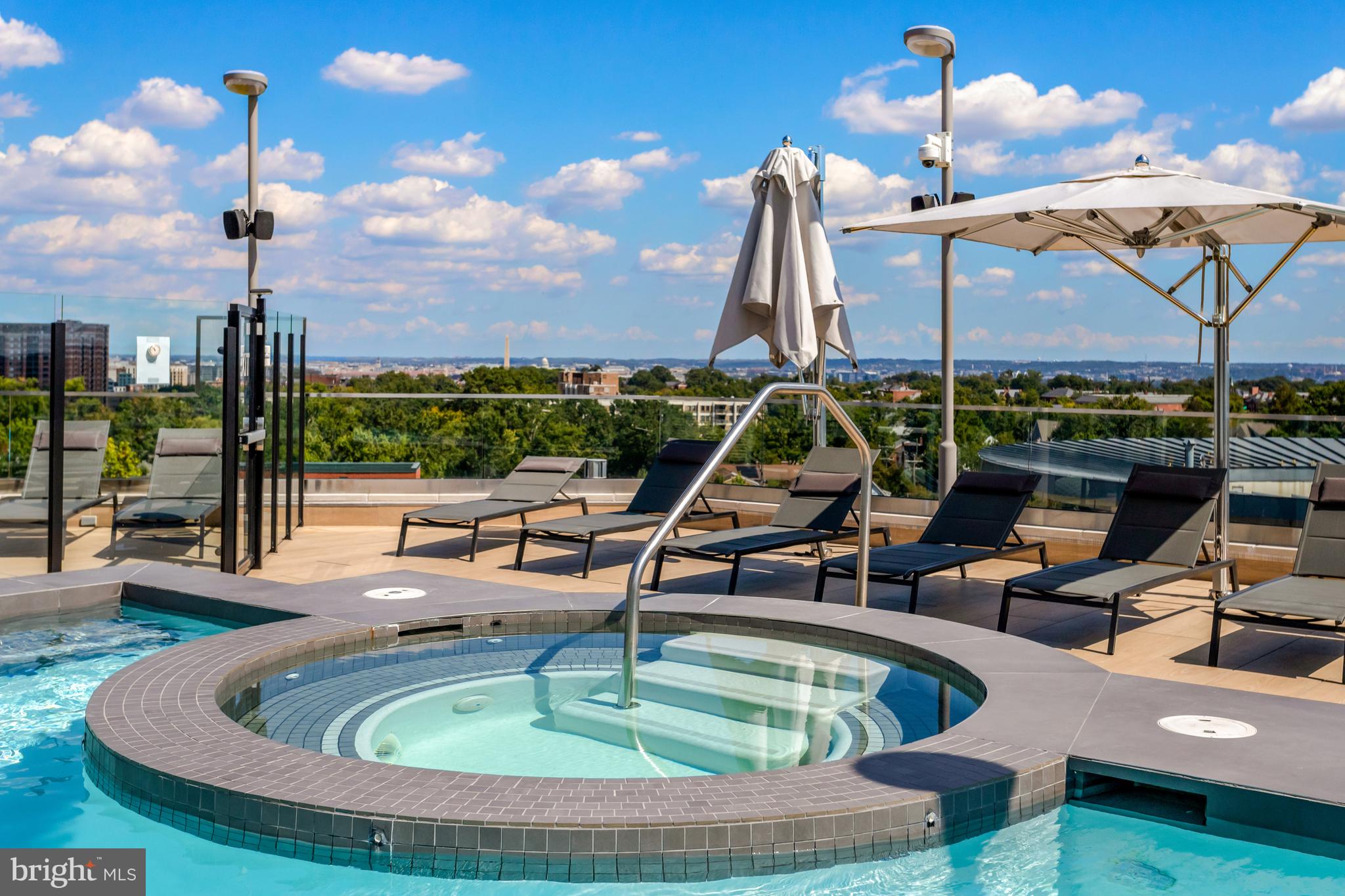 1021 North Garfield Street, Unit 914 Arlington, VA 22201 - Photo 29 of 63 a view of a swimming pool with a ocean from a patio
