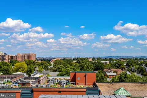 a view of roof deck with patio