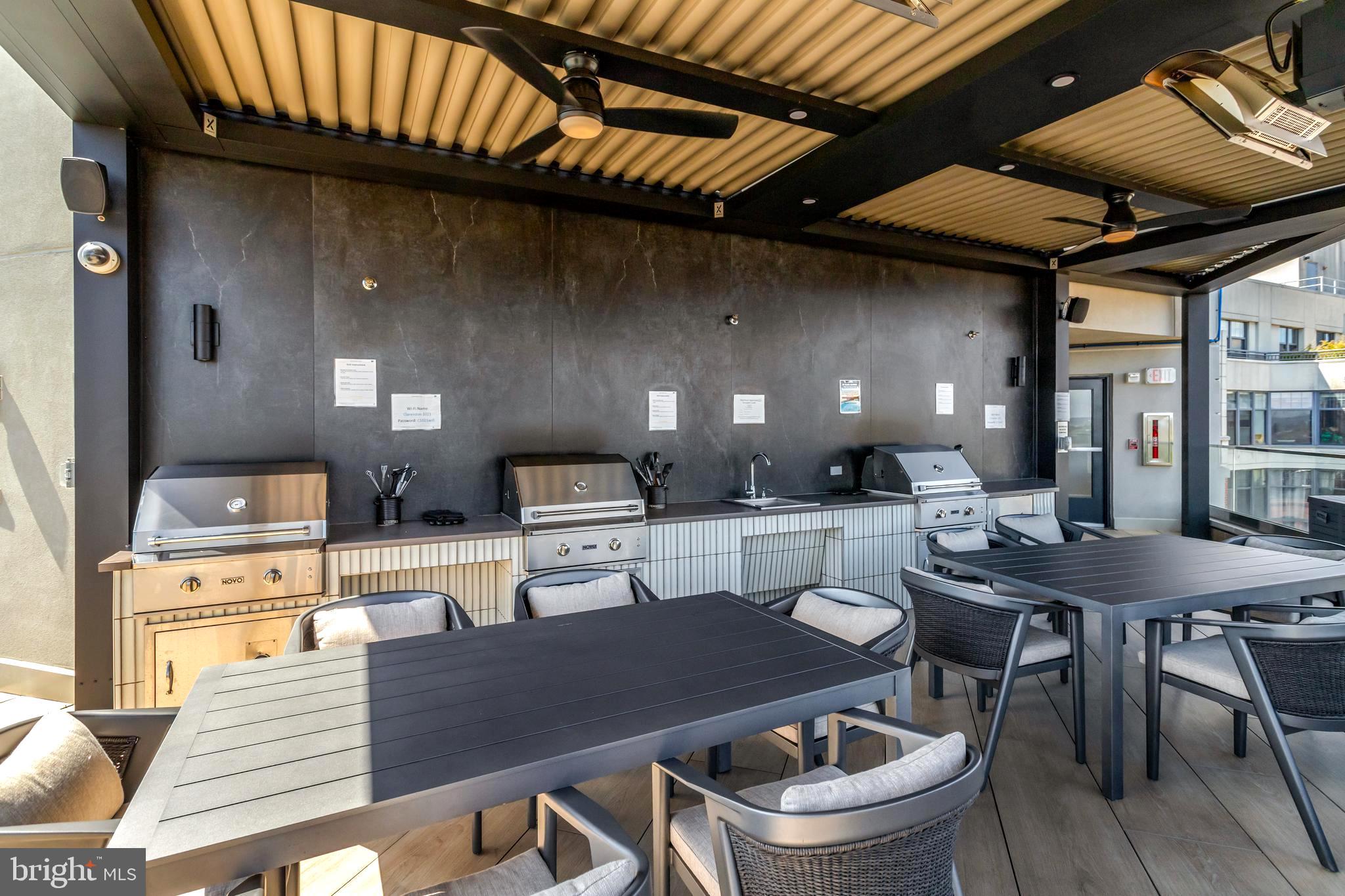 1021 North Garfield Street, Unit 914 Arlington, VA 22201 - Photo 34 of 63 a dinning table and chairs in a patio