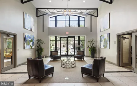 a front view of a house with a yard and table and chairs