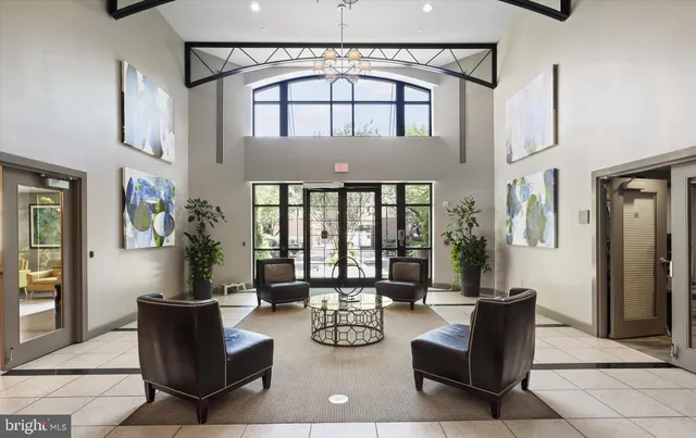 a front view of a house with a yard and table and chairs