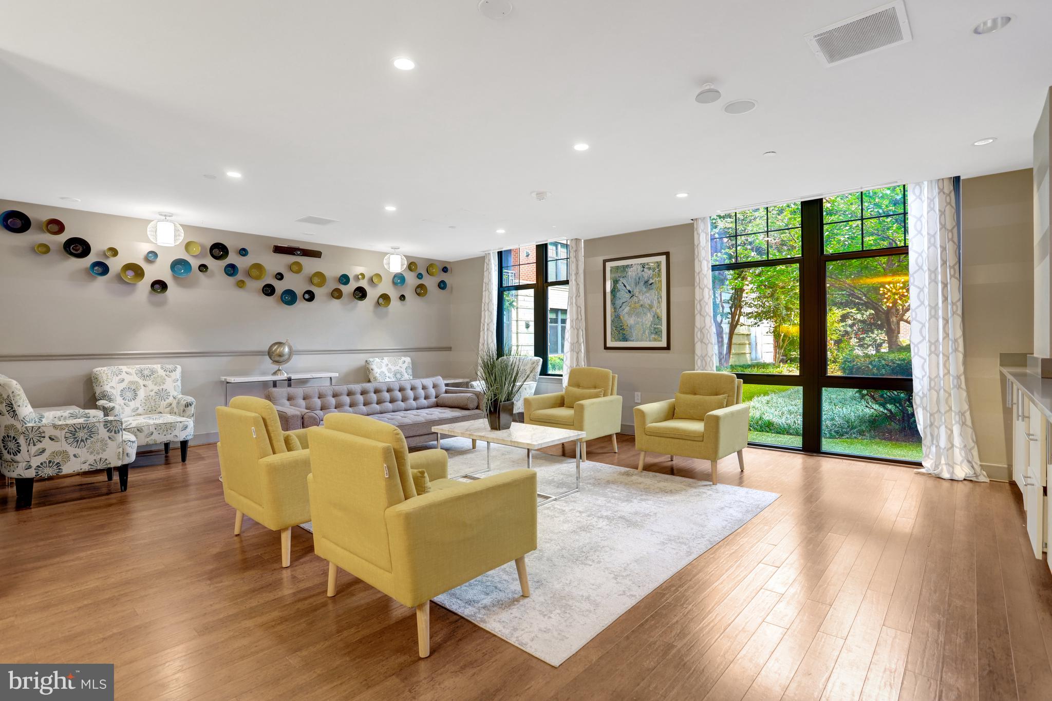 1021 North Garfield Street, Unit 914 Arlington, VA 22201 - Photo 45 of 63 a living room with furniture and a large window