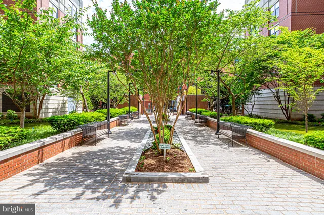 a front view of a building with a garden