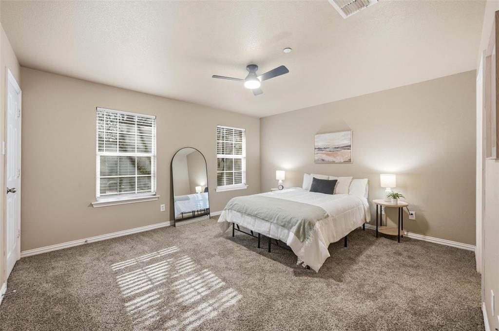 2522 Durango Ridge Drive Bedford, TX 76021 - Photo 15 of 35 Carpeted bedroom with baseboards and ceiling fan