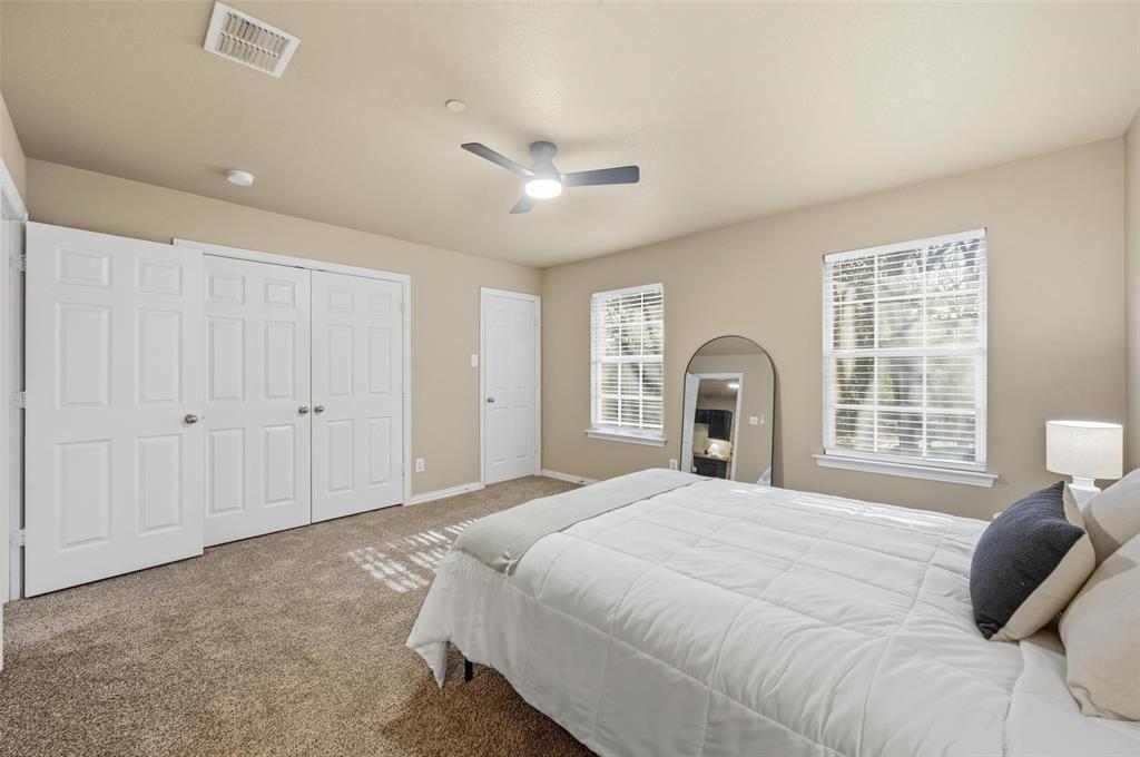 2522 Durango Ridge Drive Bedford, TX 76021 - Photo 18 of 35 Carpeted bedroom featuring a closet and a ceiling fan