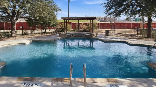 a view of a swimming pool with a patio