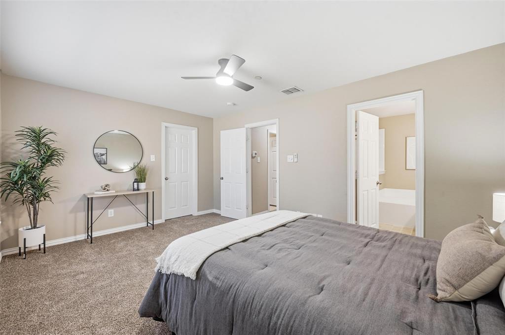 2522 Durango Ridge Drive Bedford, TX 76021 - Photo 21 of 35 Bedroom featuring carpet flooring, a ceiling fan, and ensuite bathroom