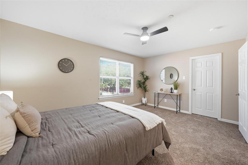 2522 Durango Ridge Drive Bedford, TX 76021 - Photo 22 of 35 Bedroom with carpet and a ceiling fan