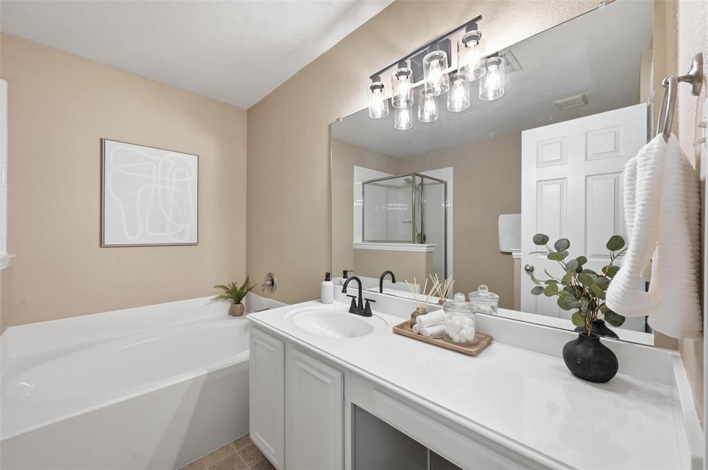 2522 Durango Ridge Drive Bedford, TX 76021 - Photo 23 of 35 Full bathroom featuring a stall shower, a bath, and vanity