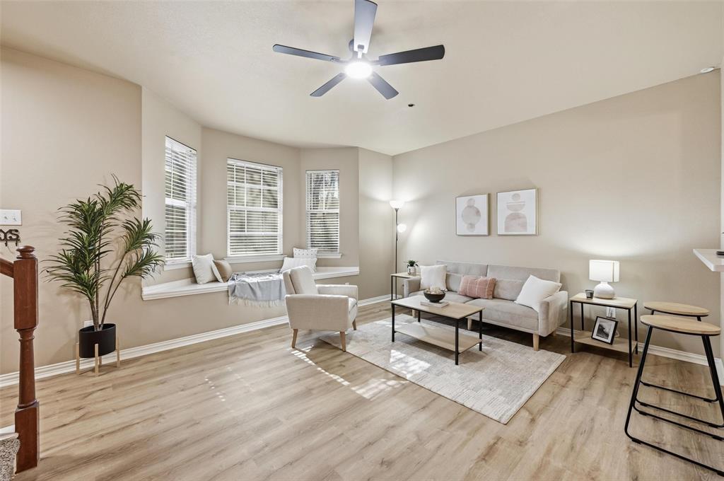 2522 Durango Ridge Drive Bedford, TX 76021 - Photo 4 of 35 Living area with a ceiling fan and light wood finished floors