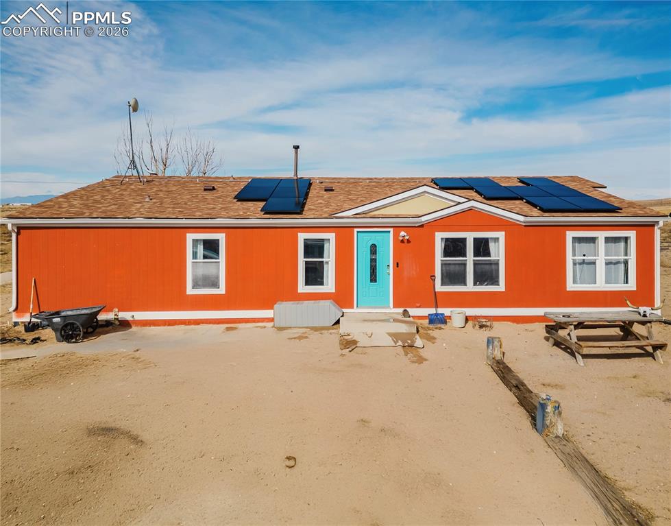 a front view of a house with yard