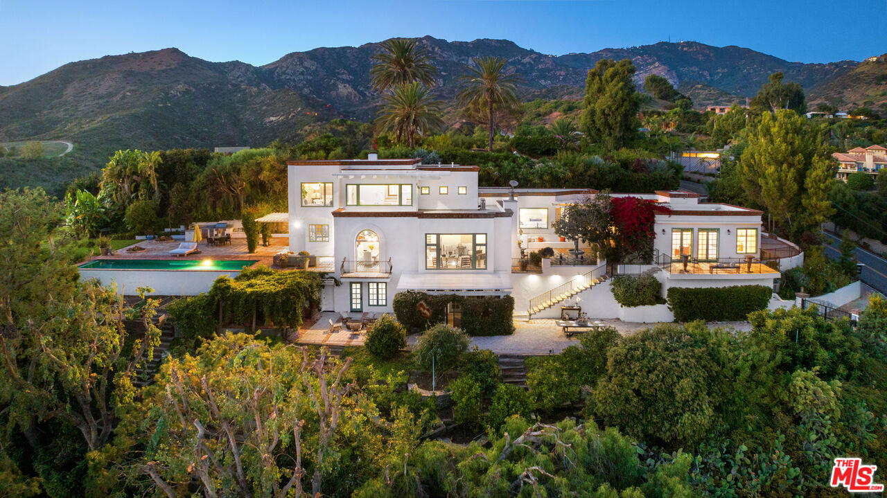 22355 Carbon Mesa Road Malibu, CA 90265 - Photo 2 of 69 a view of a town with mountains in the background