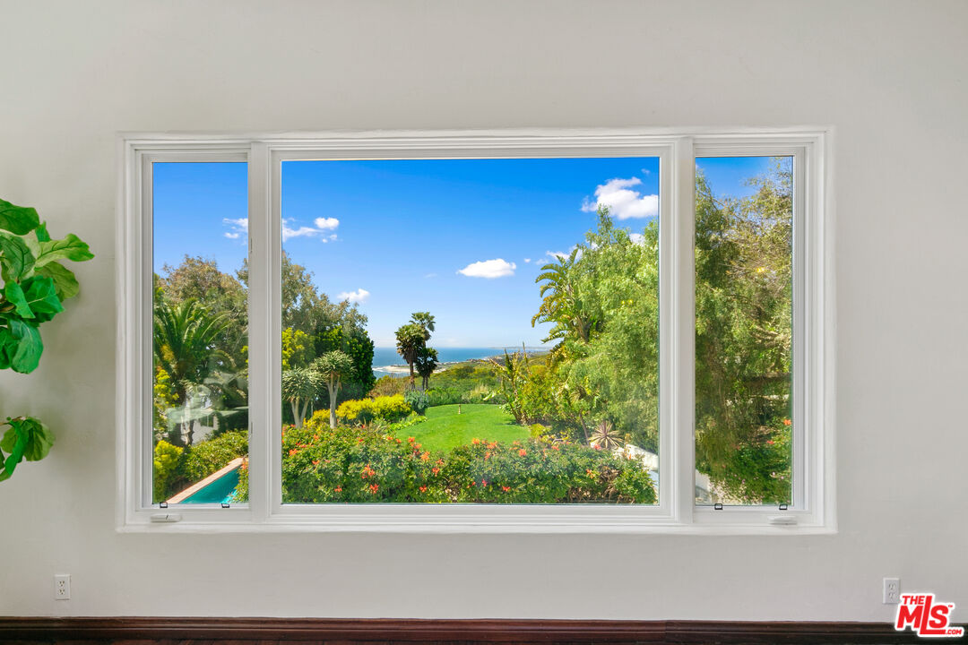 22355 Carbon Mesa Road Malibu, CA 90265 - Photo 38 of 69 a view of a floor to ceiling window and potted plants