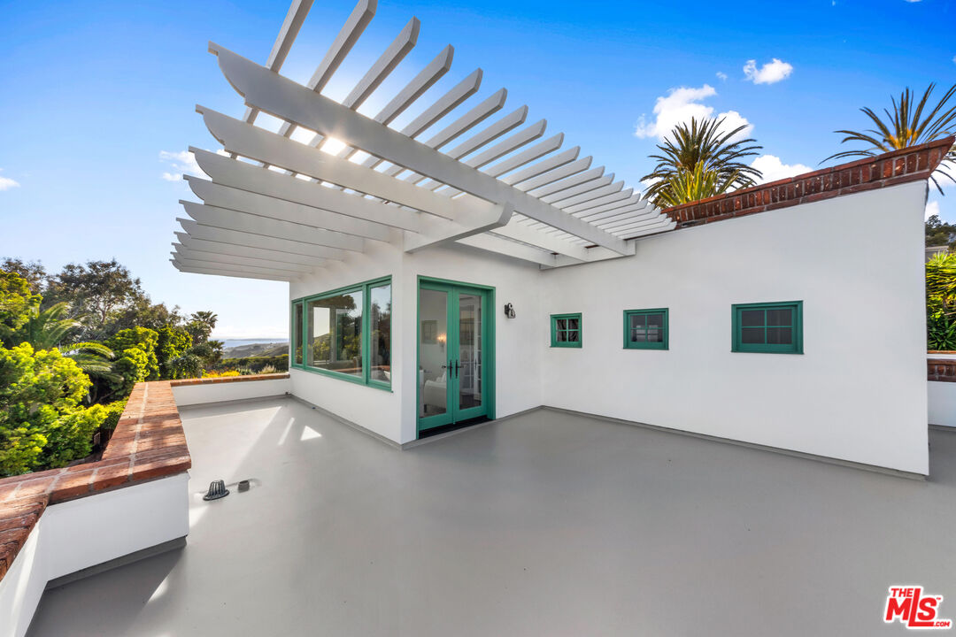 22355 Carbon Mesa Road Malibu, CA 90265 - Photo 45 of 69 a view of a building with a potted plant