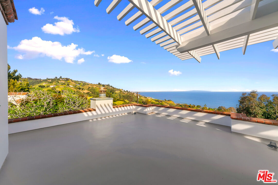 22355 Carbon Mesa Road Malibu, CA 90265 - Photo 46 of 69 a view of an ocean and a building