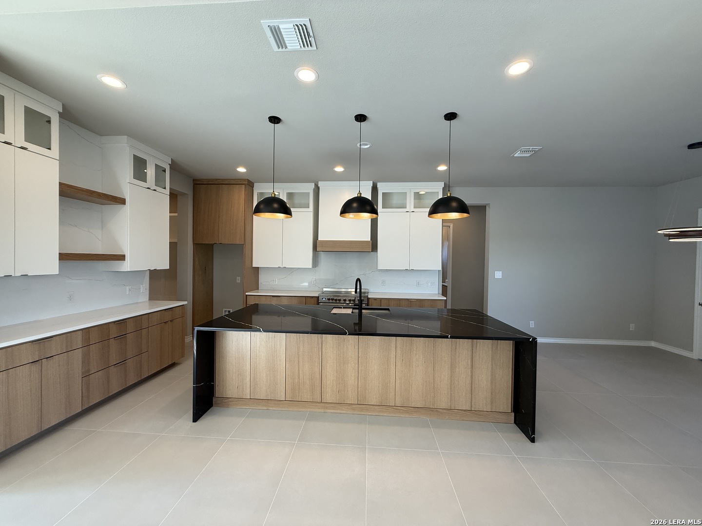 189 Mustang Lane Spring Branch, TX 78070 - Photo 13 of 53 a large kitchen with stainless steel appliances a large counter top