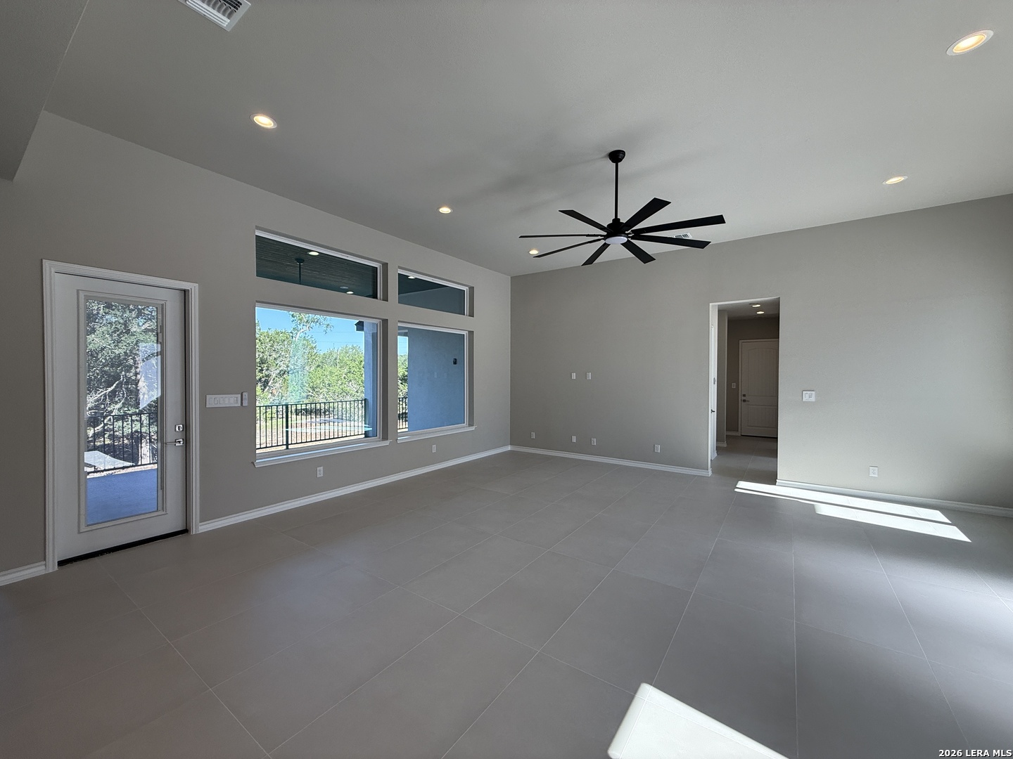 189 Mustang Lane Spring Branch, TX 78070 - Photo 16 of 53 a view of a livingroom with a ceiling fan and window