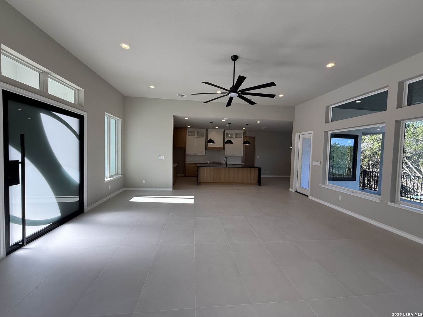 189 Mustang Lane Spring Branch, TX 78070 - Photo 22 of 53 a view of a livingroom with a ceiling fan and window
