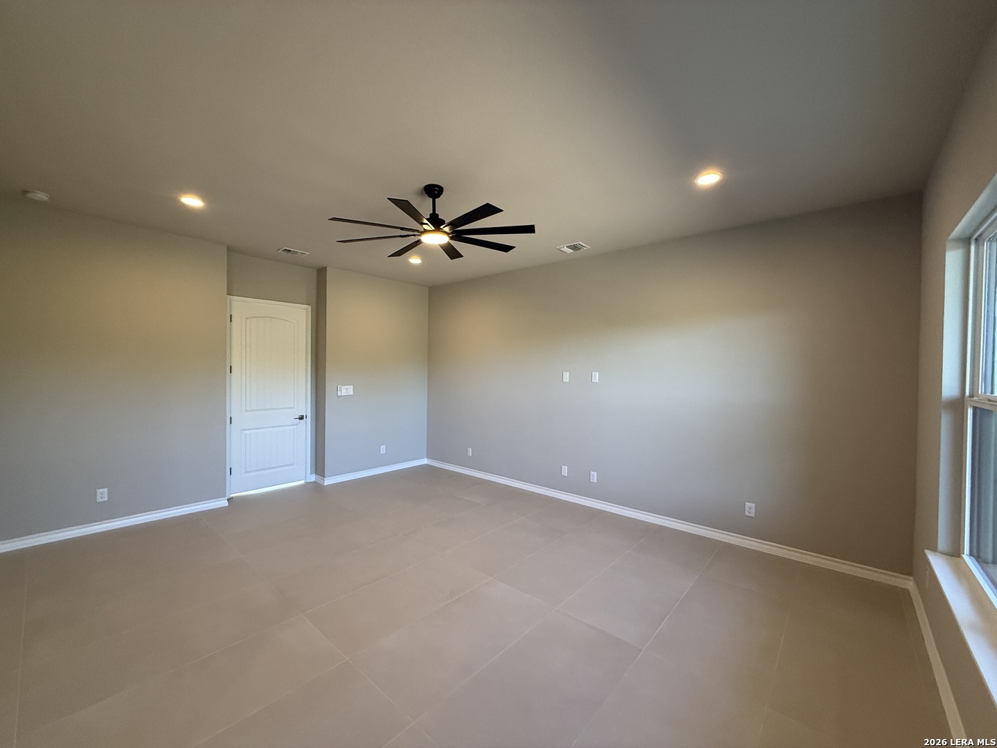 189 Mustang Lane Spring Branch, TX 78070 - Photo 29 of 53 an empty room with a fan & a window