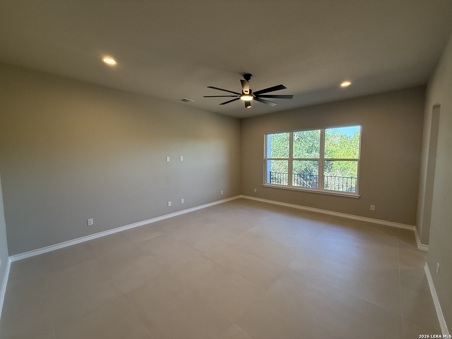 189 Mustang Lane Spring Branch, TX 78070 - Photo 30 of 53 an empty room with a window and a fan