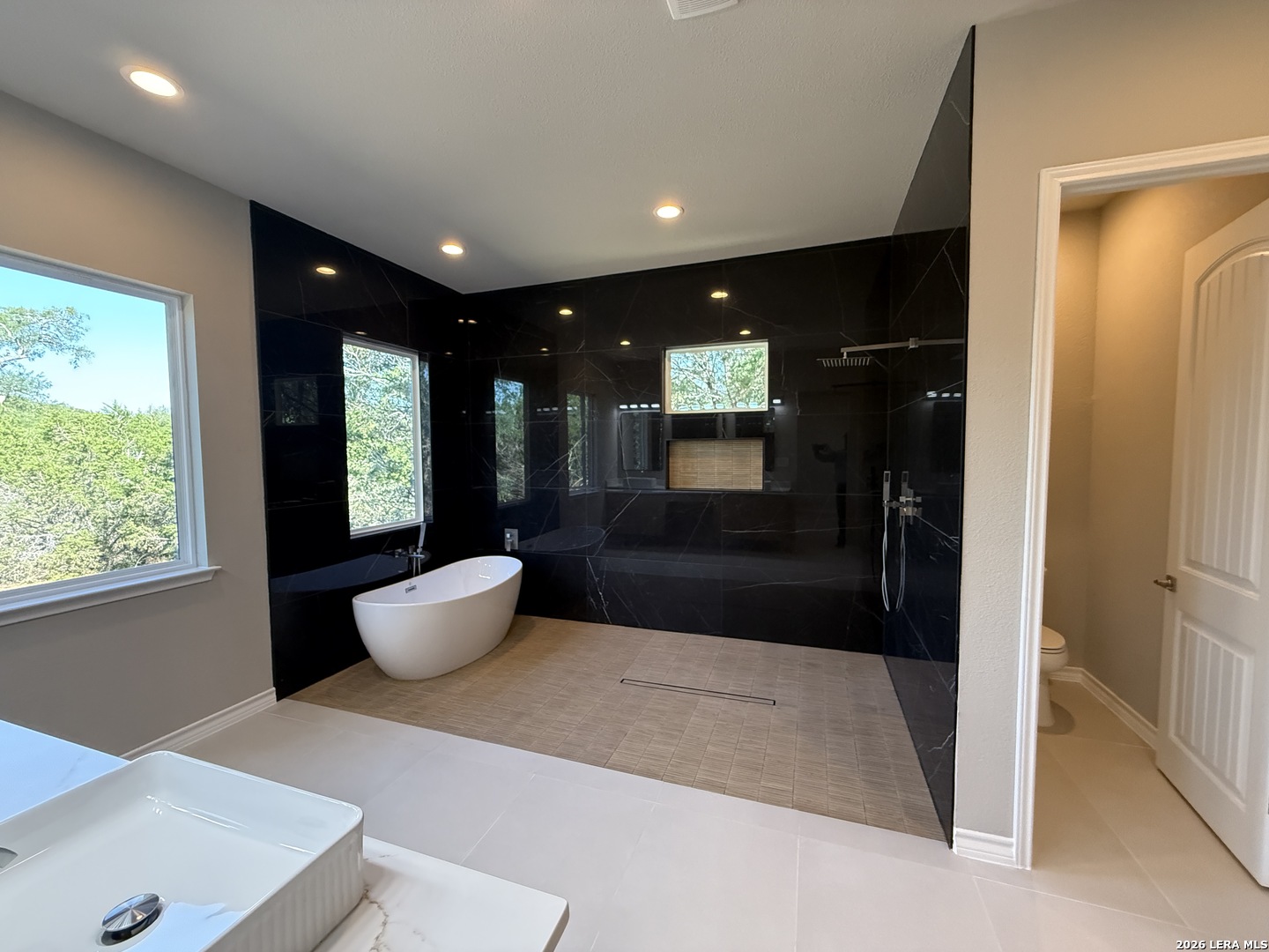 189 Mustang Lane Spring Branch, TX 78070 - Photo 37 of 53 a bathroom with a shower