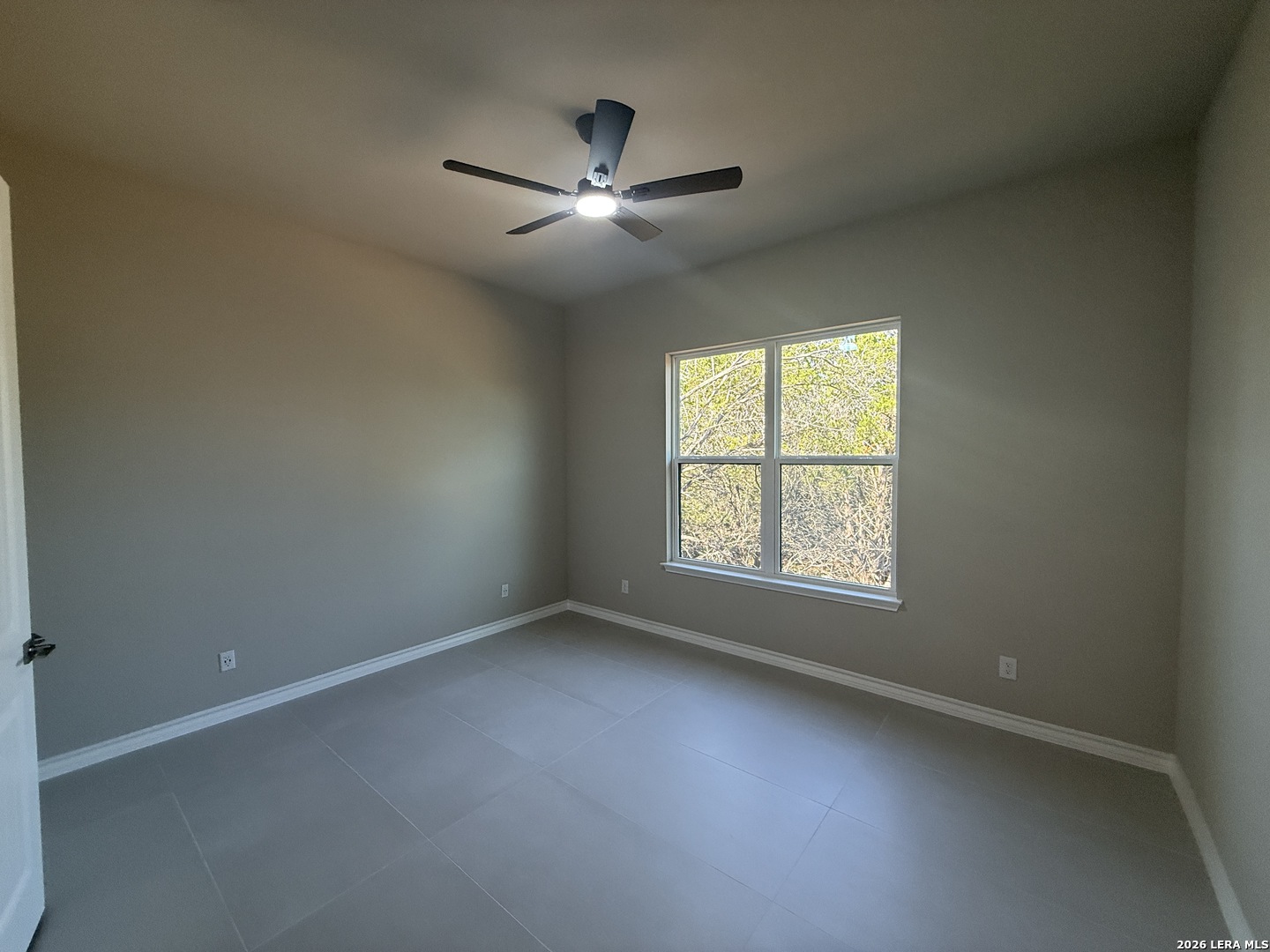 189 Mustang Lane Spring Branch, TX 78070 - Photo 41 of 53 an empty room with windows and fan