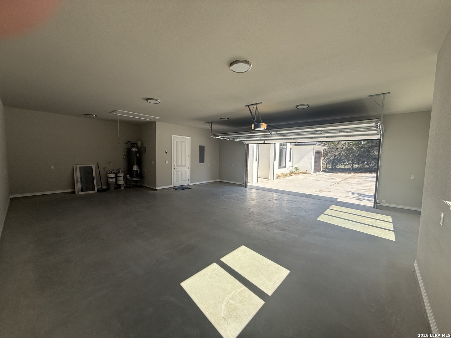 189 Mustang Lane Spring Branch, TX 78070 - Photo 45 of 53 an empty room with wooden floor and windows