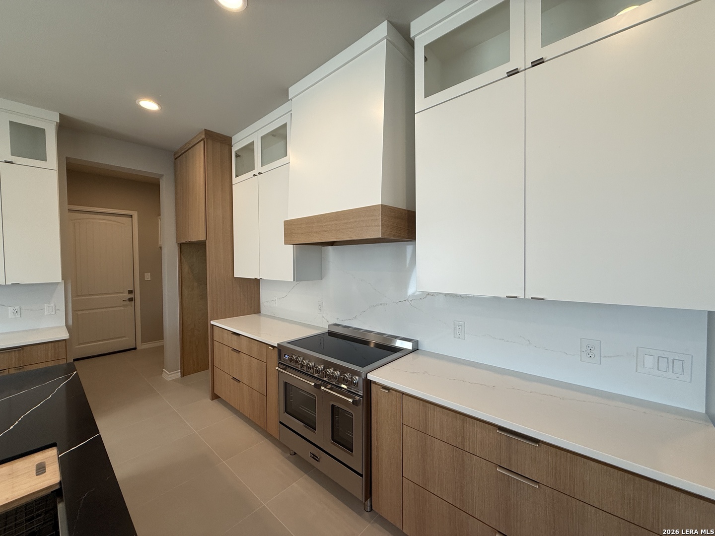 189 Mustang Lane Spring Branch, TX 78070 - Photo 8 of 53 a kitchen with stainless steel appliances a stove and a refrigerator