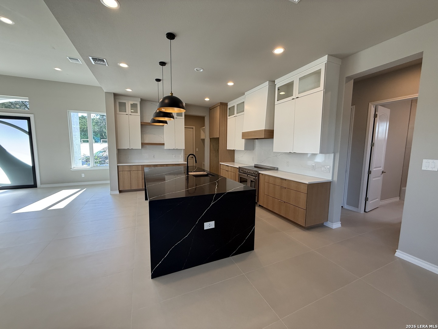189 Mustang Lane Spring Branch, TX 78070 - Photo 10 of 53 a kitchen with kitchen island a sink stainless steel appliances and cabinets