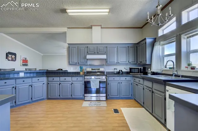 a view of a hallway with wooden floors and stairs